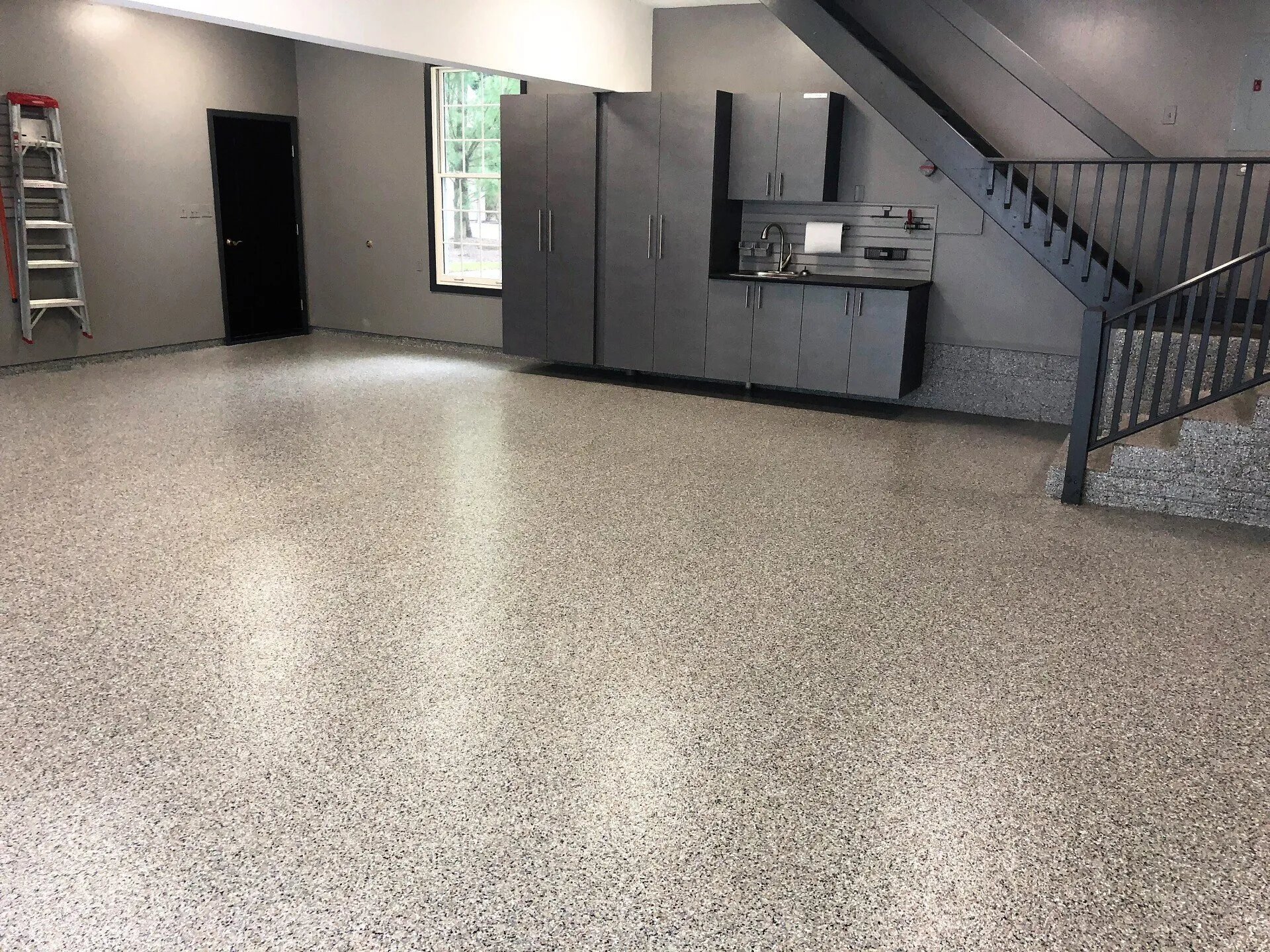 minimalistic dark garage cabinets in spacious garage