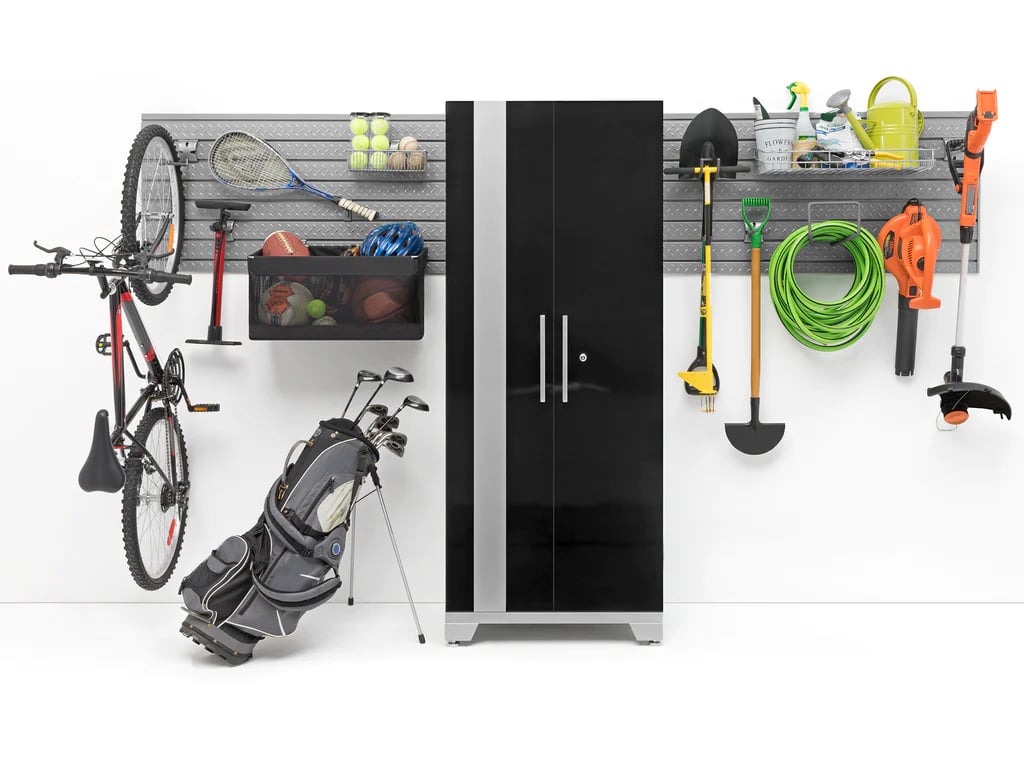 black storage cabinet, sports equipment, bike, and gardening tools 