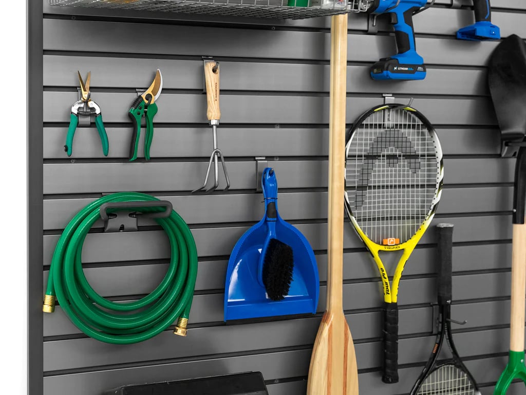 green gardening tools and tennis racket on slatwall