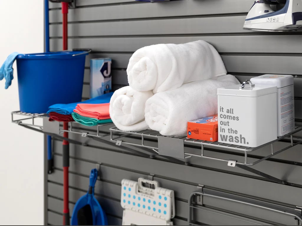 laundry supplies sitting on shelves connected to slatwall