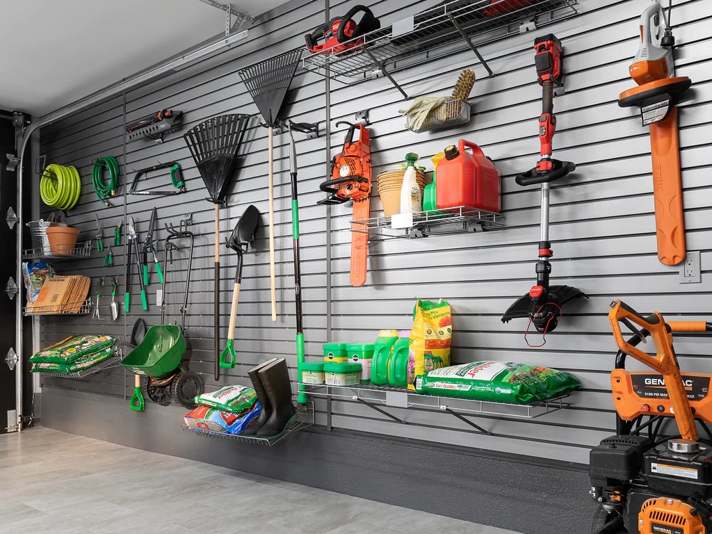 large range of gardening equipment on gray slatwall