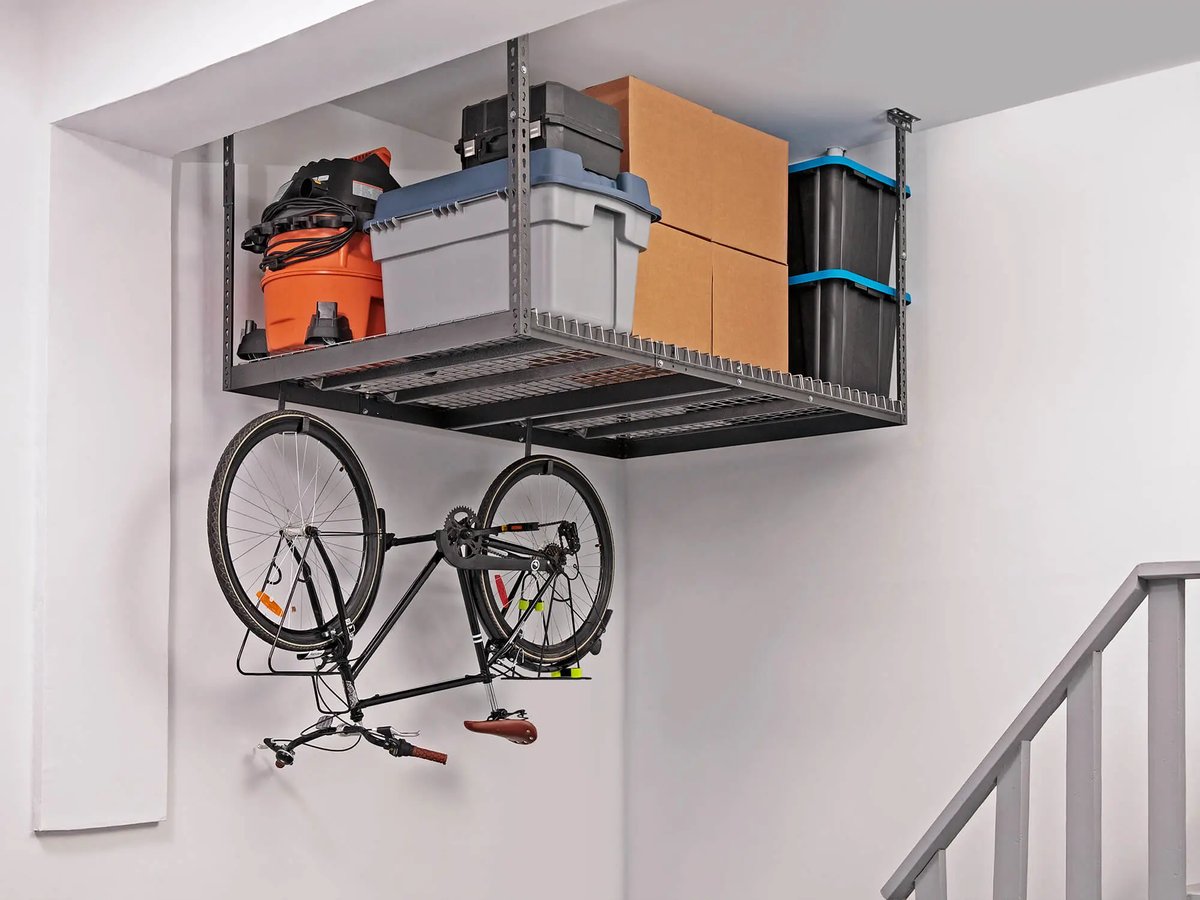 bins and totes stored in overhead rack with bike hanging underneath