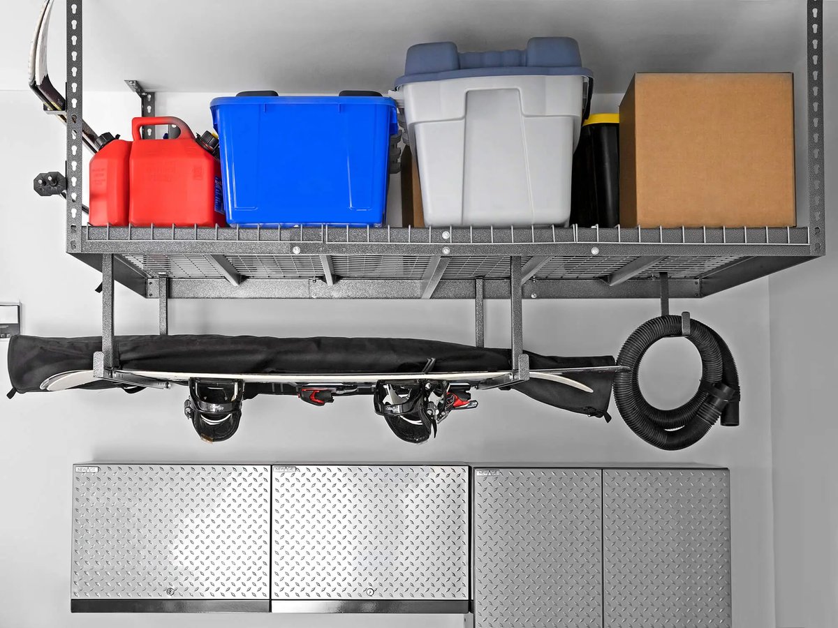 snow gear and cords below full ceiling mounted storage rack 