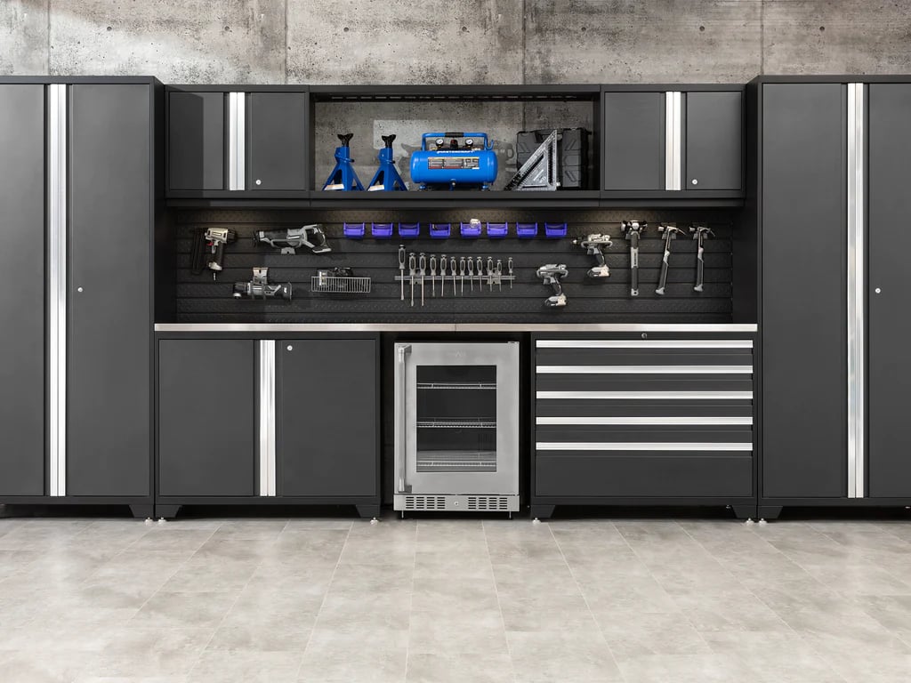 black sleek cabinets with fridge and hanging tools