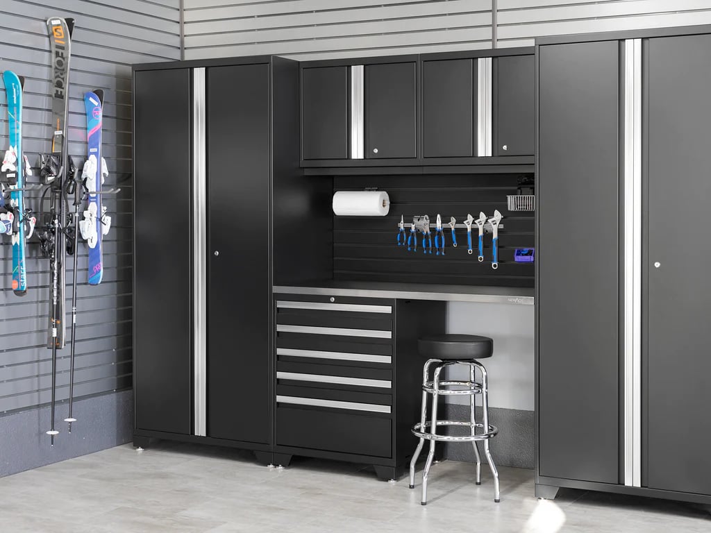 black cabinet storage with ski gear on slatwall